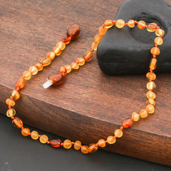 Collier de dents en ambre pour bébé