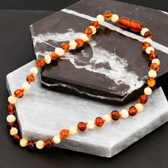 Collier de dents en ambre pour bébé