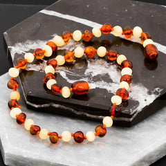 Collier de dents en ambre pour bébé