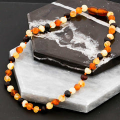 Collier de dents en ambre pour bébé