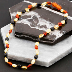 Collier de dents en ambre pour bébé