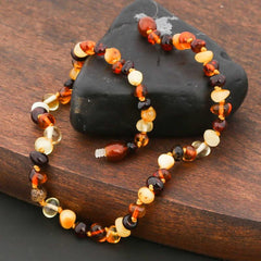 Collier de dents en ambre pour bébé