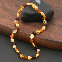 Collier de dents en ambre pour bébé