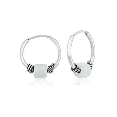 Boucles d'oreilles créoles en argent et pierre blanche