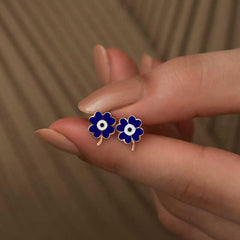 Boucles d'oreilles trèfle bleu marine fluorescentes argentées
