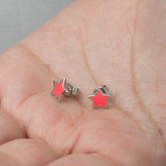 Boucles d'oreilles étoile rose fluorescente argentée