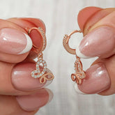 Boucles d'oreilles pendantes en argent avec papillon rose pour femme