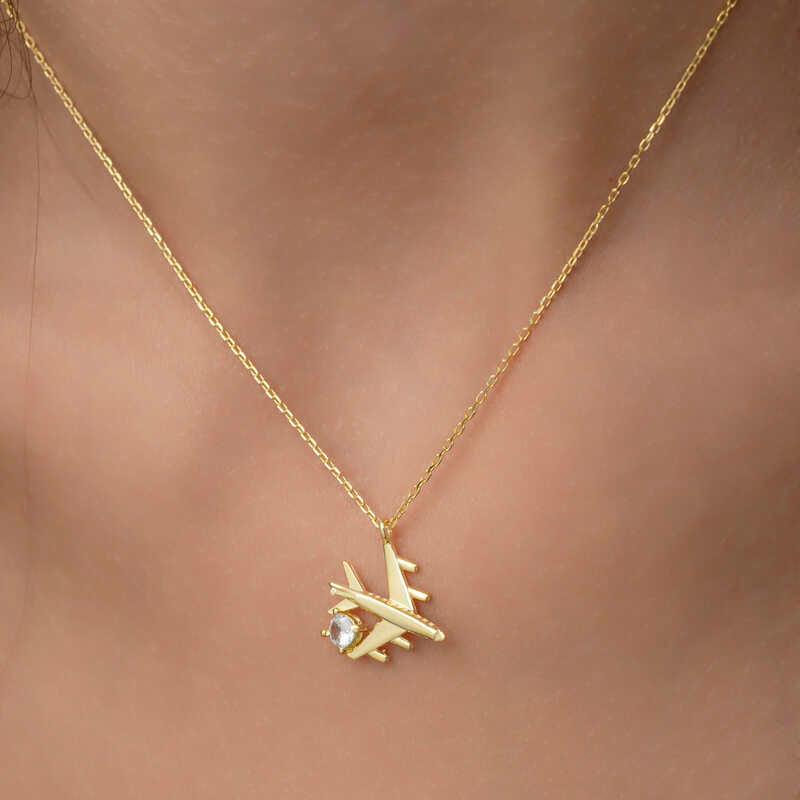 Collier pour femme en argent et or avec une seule pierre représentant un avion