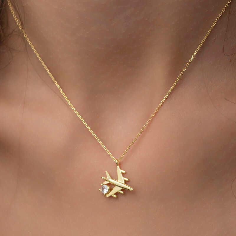 Collier pour femme en argent et or avec une seule pierre représentant un avion