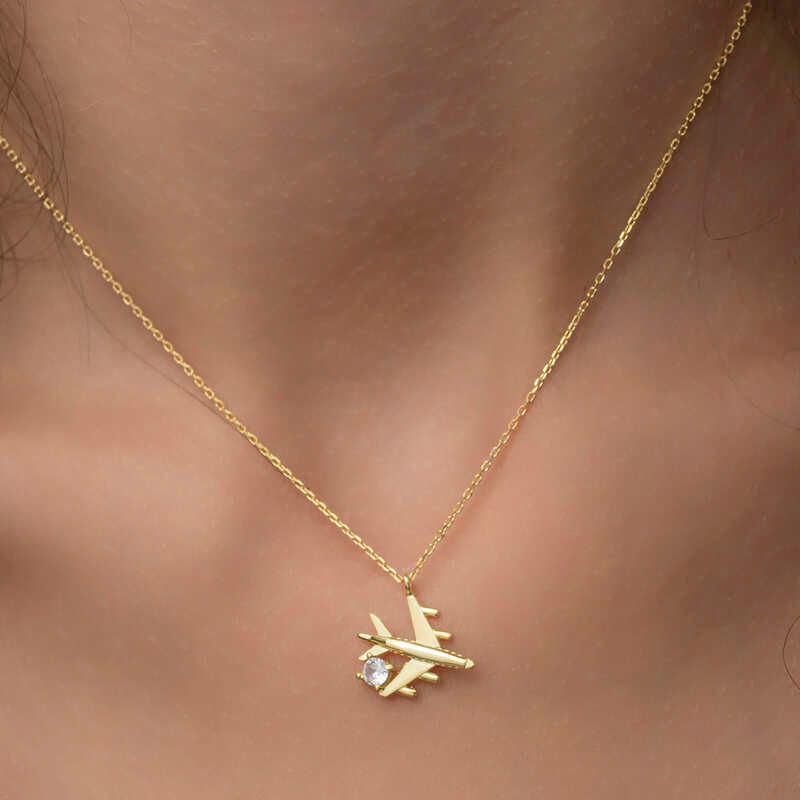 Collier pour femme en argent et or avec une seule pierre représentant un avion