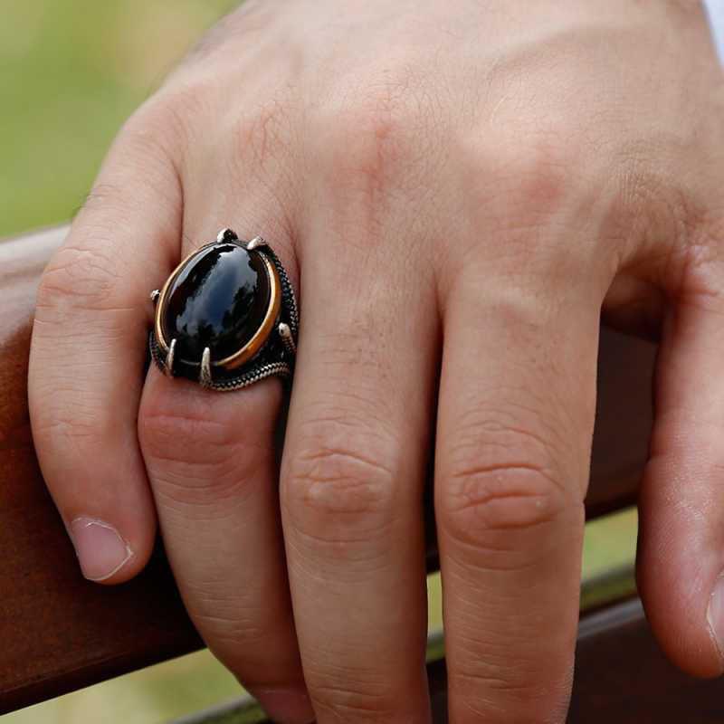 Bague homme en argent et pierre noire avec griffe d'aigle