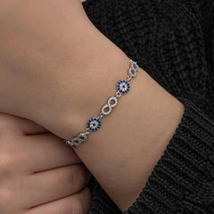 Bracelet infini en argent avec perles mauvais œil pour femme